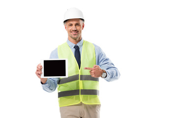 smiling engineer pointing with finger at digital tablet with blank screen isolated on white