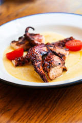 Mediterranean Octopus with vegetables and potatoes