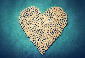 Big heart made from little wooden hearts