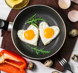 Fried eggs on wooden table