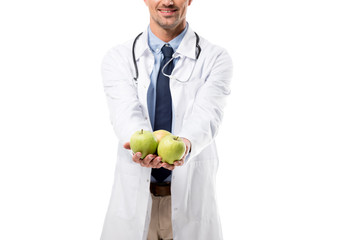 cropped view of doctor holding fresh apples in hands isolated on white, healthy eating concept