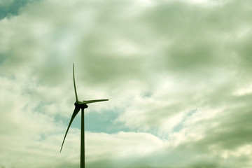 wind turbine against a cloudy sky