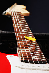 Fototapeta na wymiar Guitar neck on amplifier