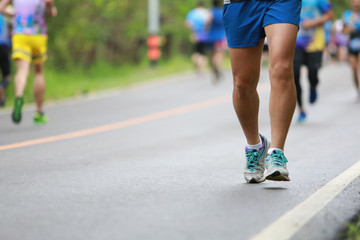 Group of people running race marathon