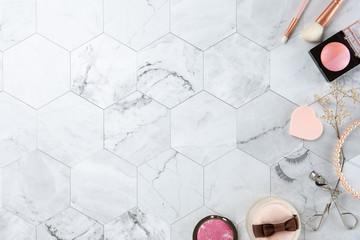 make up cosmetic flat lay top view on the tile marble white color look clean with copy space for text