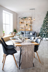 Table setting with holiday decorations. Preparation for christmas dinner