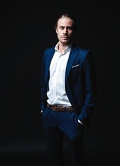 Fototapeta premium Elegant young handsome man. Studio fashion portrait