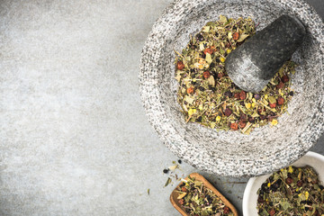 Mixed dry herbs in mortar or pestle,healthy herbal tea