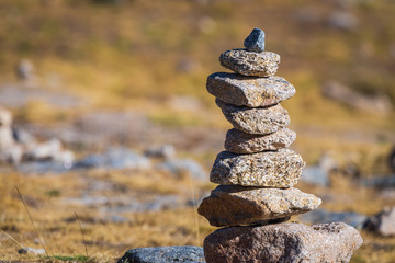 Zen balanced stones stack in high mountains. Scenic mountain view.