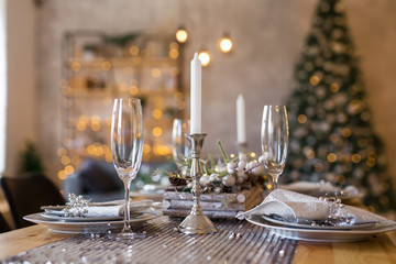 Table setting with holiday decorations. Preparation for christmas dinner