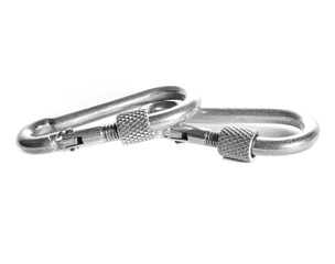 Isolated mountaineering in two object metal carbine is fastened. Set of climbing and camp...