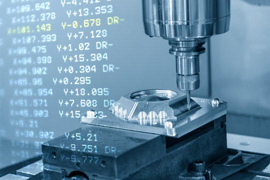 The abstract scene of  CNC milling machine and the G-code data cutting the mold part.The hi-precision CNC milling machine.