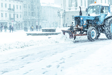 snowplow close up cleaning street of snow