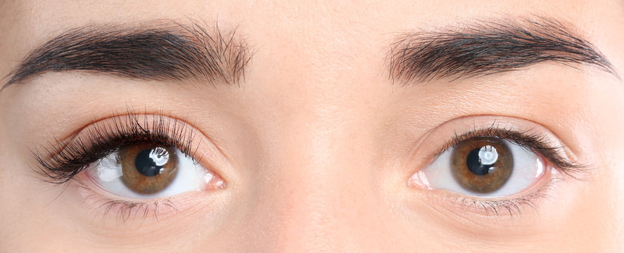 Closeup view of beautiful young woman before and after eyelash extension procedure