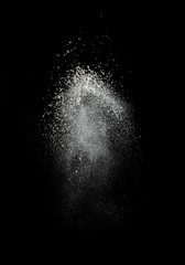Splash cloud of wheat flour on black background