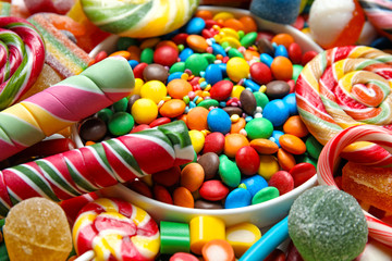 Many different yummy candies as background, closeup