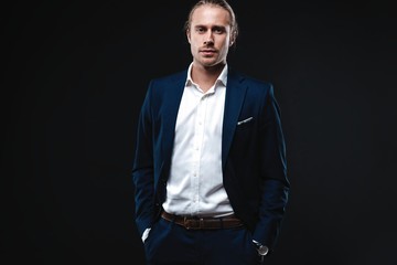Fototapeta premium Elegant young handsome man. Studio fashion portrait