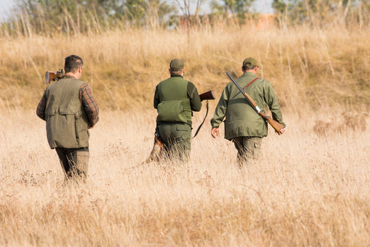 The hunter in the hunting clothes and with rifle hunts