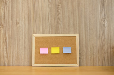 sticky notes reminder on cork board. bulletin corkboard