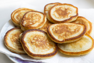 Fried Russian curd fritter pancakes on a plate. Buffet breakfast.