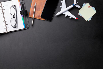 Business trip concept. Accessories on desk table