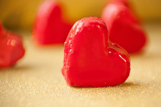Valentine's day concept. gift for Valentine's Day, sweet hearts on a gold background. Pictures of Love. selective focus © ritiniya