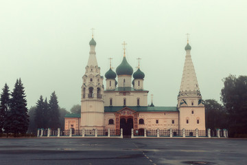 Fototapeta na wymiar Architecture of Yaroslavl town, Russia. Old orthodox church of Elijah the Prophet at the early morning in the fog. UNESCO World Heritage Site.