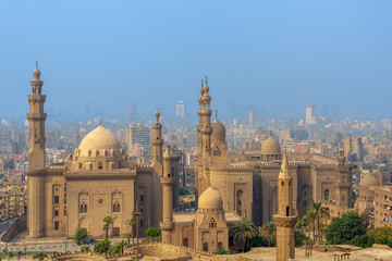 Aerial view of Cairo city from Salah Al Deen Citadel (Cairo Citadel) with Al Sultan Hassan and Al Rifai Mosques, Cairo, Egypt - obrazy, fototapety, plakaty