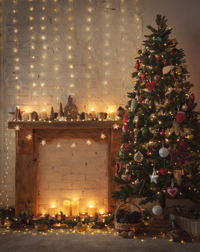 Beautiful Christmas setting, fireplace with wooden mantelpiece fire surround, lit up decorated Christmas tree with baubles and ornaments, stars, Christmas lights, toned, candles, selective focus