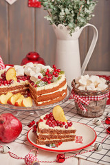 Christmas cake and cookies on table. Christmas  decorations with lights background. Happy New Year! Christmas greeting card. Winter card template. Xmas concept. Holiday Banner. Feast of Nativity. 