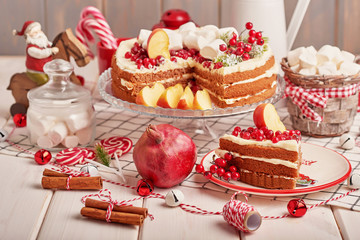 Christmas cake and cookies on table. Christmas  decorations with lights background. Happy New Year! Christmas greeting card. Winter card template. Xmas concept. Holiday Banner. Feast of Nativity. 
