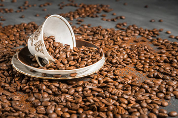 Flying coffee beans on dark background