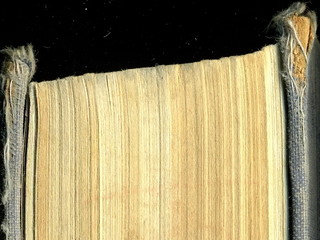 Yellowed pages of the old dilapidated book. Old book.