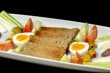 Delicious breakfast on white plate