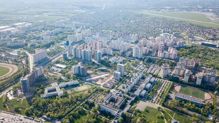 Aerial view, landscape part of the modern city and private homes spring sunny day Kyiv, Ukraine. Photo from drone