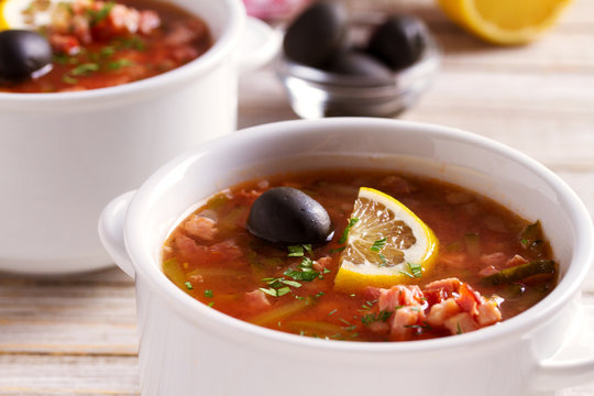 Traditional Russian dish  solyanka - thick, spicy and sour saltwort soup