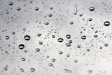 water drop. Water drops on glass surface as background. Drops of rain on glass. Sky background. Thailand.