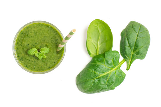 Spinach Smoothies. Healthy Green Juice Iwith Spinach Leaves Solated On White Background. Top View