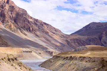 Picture of river among the sand dunes and clouds.