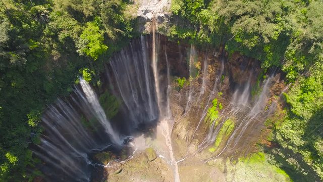 aerial view waterfall coban sewu in Java, indonesia. waterfall in tropical forest by drone Tumpak Sewu aerial footage