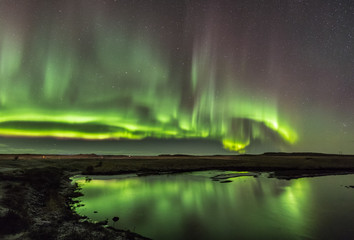 Fototapeta na wymiar Northern Lights on Cold Icelandic Nights