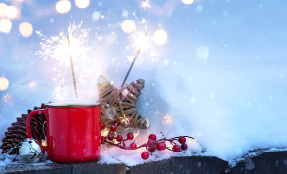 christmas holidays background; winter hot drink and Christmas holidays Light on snow;