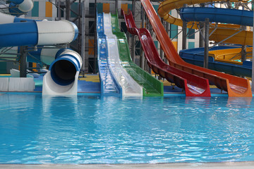 Water park. Blue pool slide swimming. Aquapark.