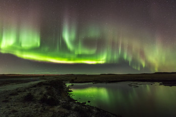 Fototapeta na wymiar Northern Lights on Cold Icelandic Nights