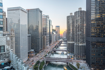 Chicago skylines along river walk at sunset, aerial view of modern buildings