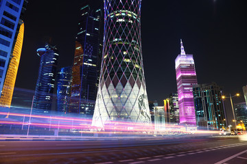 Night road traffic in financial centre in Doha, Qatar