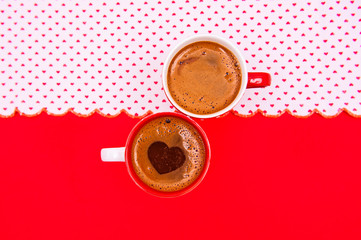 Cup of coffee on the red background