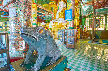 SAGAING, MYANMAR - FEBRUARY 21, 2018: The statue of a Frog, bringing luck and prosperity in prayer...