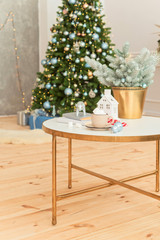 Christmas chocolate with marshmallows in the living room by the Christmas tree