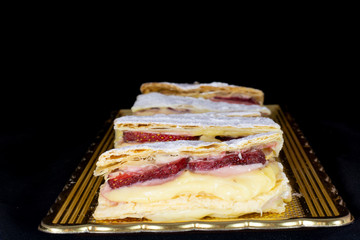 French Mille-feuille cake with fresh strawberry with isolated black background